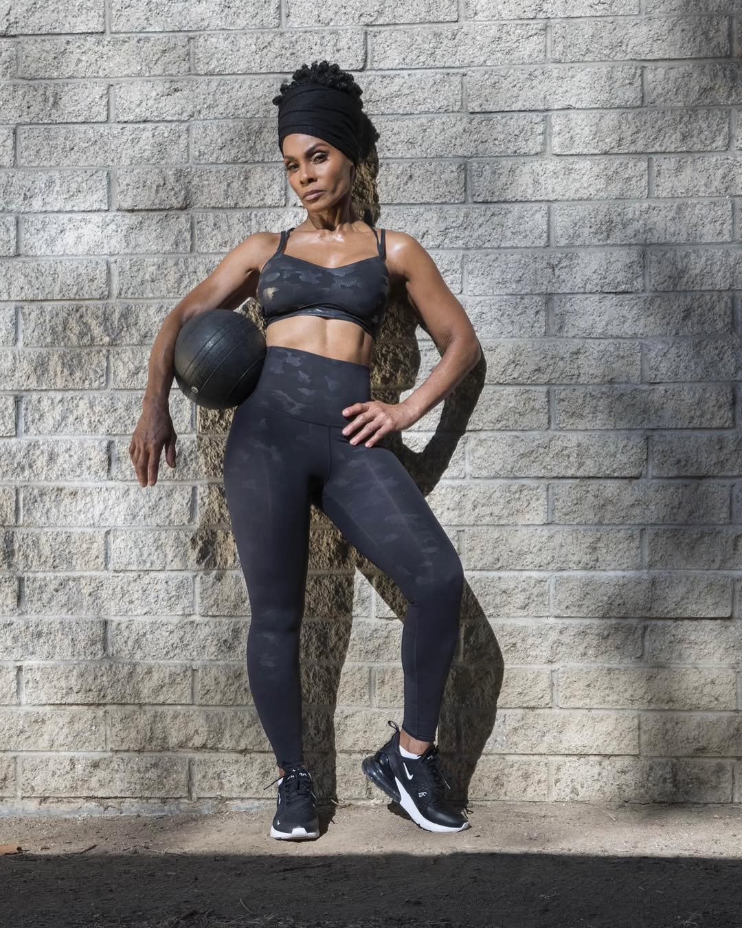 Woman holding medicine ball